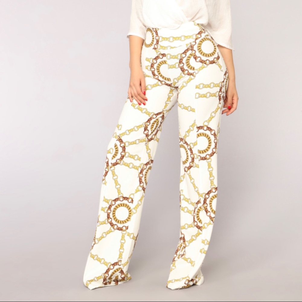 Ivory flared pants- chained detailing.